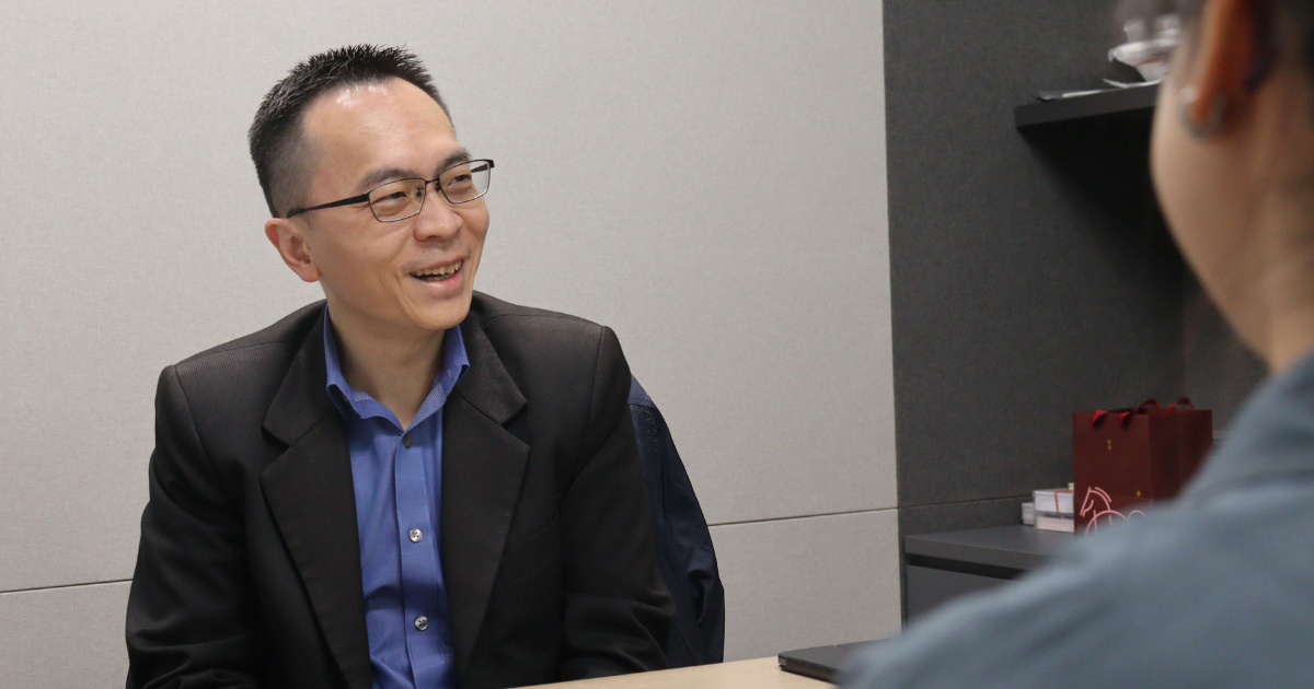 EnterpriseSG's Assistant Managing Director Johnny Teo smiling