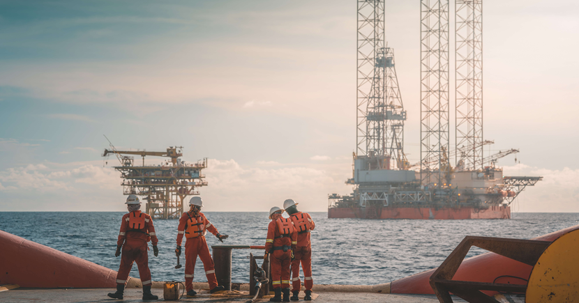 Offshore workers standing on a vessel deck