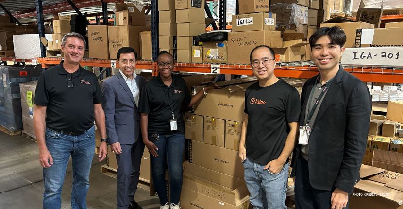Anthony Chow alongside EnterpriseSG's Regional Director Kennie Ong at igloo’s warehouse 