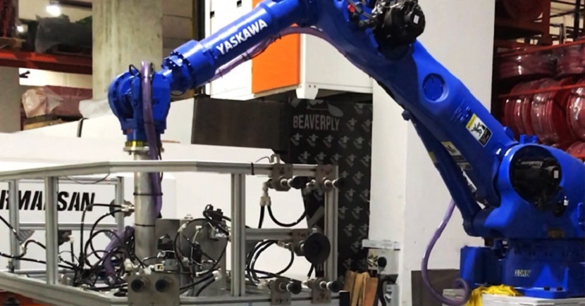 Robotic arms help workers to assemble fire extinguishers in Lingjack's factory