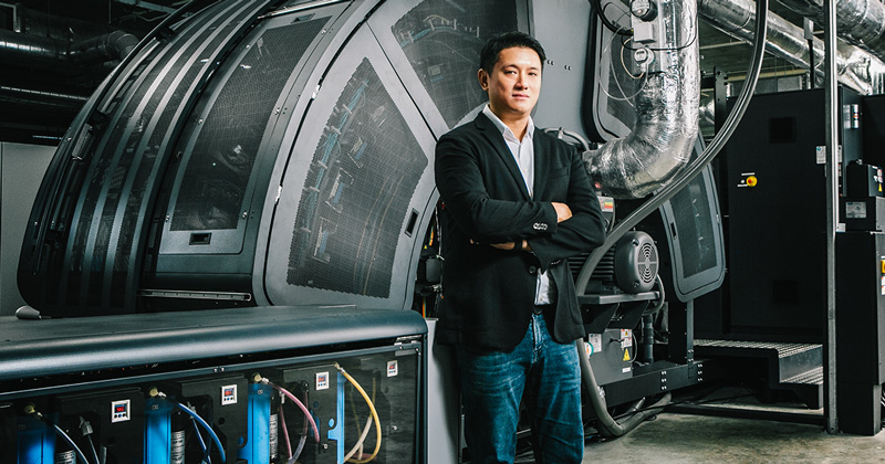 Markono managing director Edwin Ng with a high-speed inkjet printer