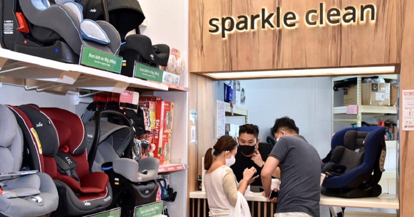 Customers consulting staff at the Mothercare Experience Store