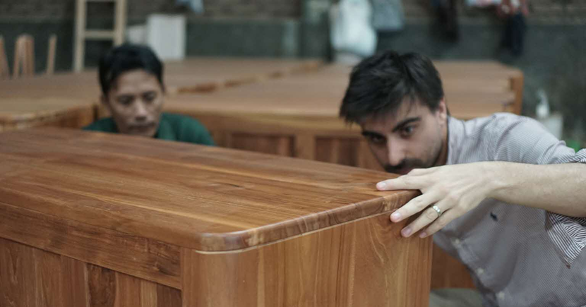 Quality inspectors carrying out checks on furniture on