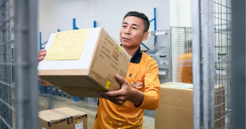 XDel officer with a parcel