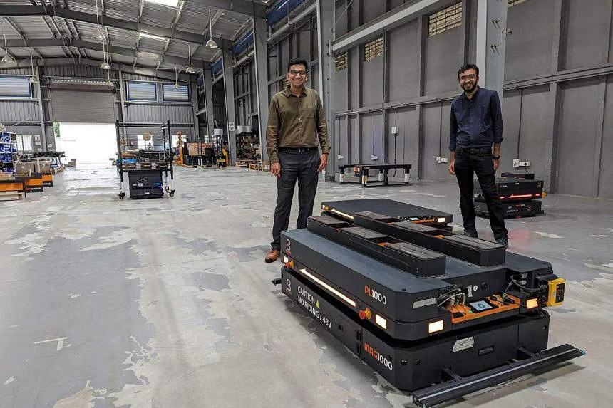 Botsync co-founder Nikhil Venkatesh (left) demonstrating a lifter in the company’s assembly and research plant in Bengaluru, India. ST PHOTO: ROHINI MOHAN