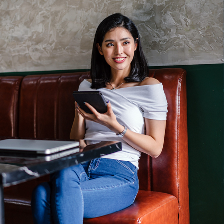 Female holding onto a tablet